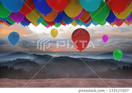 Many colourful balloons above landscape Many colourful balloons above landscape 133525807