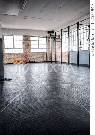 Vector flat design showing empty CrossFit gym with rubber flooring, pull up rig, rings, kettlebells 133525949