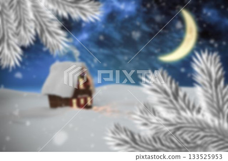 Small cabin with glowing windows is sitting in snowy field under starry sky, pine branches framing 133525953