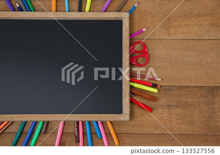 High angle view of chalkboard with multi colored equipment High angle view of chalkboard with multi colored equipment 133527556