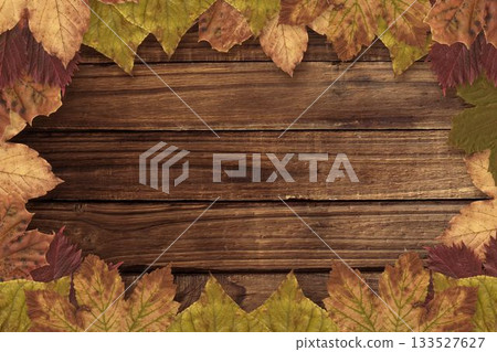 Border of dried autumn leaves is framing horizontal rustic wooden planks in flat design Border of dried autumn leaves is framing horizontal rustic wooden planks in flat design 133527627