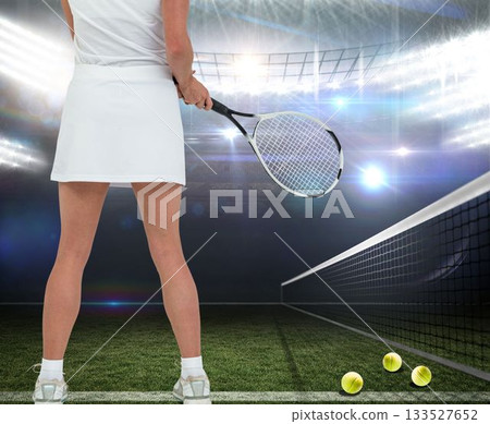 Female tennis player standing at court 133527652