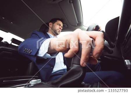 Close-up of man shifting gears Close-up of man shifting gears 133527793