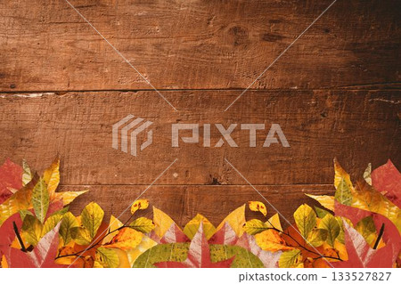 Autumn leaf border is overlaying rustic wooden plank background, using flat design autumn foliage Autumn leaf border is overlaying rustic wooden plank background, using flat design autumn foliage 133527827
