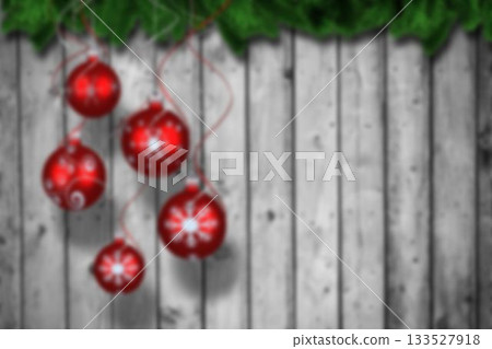 Christmas baubles hanging over wood 133527918