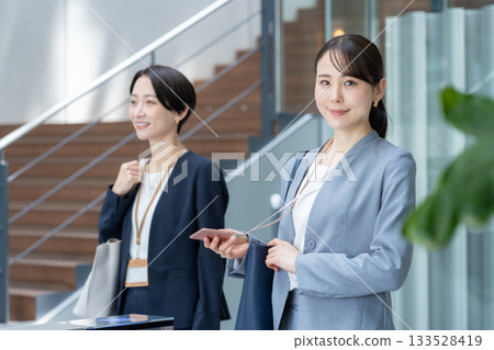 Businesswomen commuting to the office. Photo courtesy of Sky Perfect TV Tokyo Media Center. Businesswomen commuting to the office. Photo courtesy of Sky Perfect TV Tokyo Media Center. 133528419
