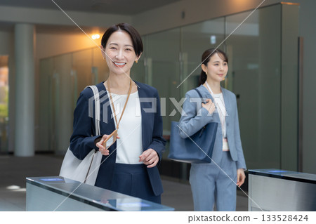 Businesswomen commuting to the office. Photo courtesy of Sky Perfect TV Tokyo Media Center. Businesswomen commuting to the office. Photo courtesy of Sky Perfect TV Tokyo Media Center. 133528424