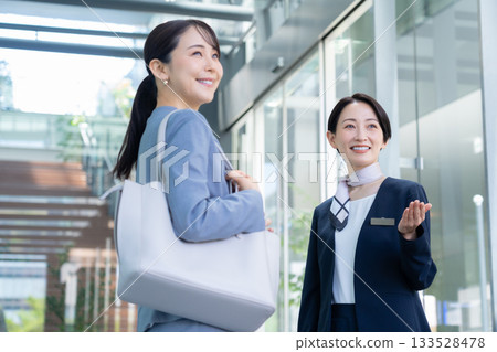 Concierge showing around the office. Filming cooperation: Sky Perfect Tokyo Media Center 133528478