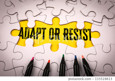 Adapt or Resist Concept with Yellow Puzzle Piece and Colored Pencils Adapt or Resist Concept with Yellow Puzzle Piece and Colored Pencils 133528613