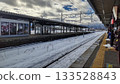 People waiting for a train at Kaminoyama Onsen Station in the snow 133528843