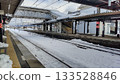 Kaminoyama Onsen Station and footbridge in a snowy landscape 133528846