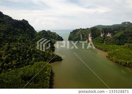 Top view of the Kilim Geopark. The river is surrounded by green hills and mangrove jungle. Langkawi Island, Malaysia 133528871