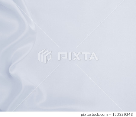 Smooth elegant grey silk or satin luxury cloth as wedding background. Luxurious background design Smooth elegant grey silk or satin luxury cloth as wedding background. Luxurious background design 133529348