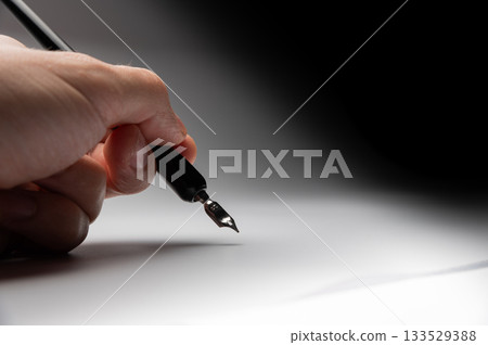 hand writes with a black pen on a clean white background with ample space for text. The hands masterfully practiced calligraphy on textured paper, surrounded by a serene atmosphere hand writes with a black pen on a clean white background with ample space for text. The hands masterfully practiced calligraphy on textured paper, surrounded by a serene atmosphere 133529388