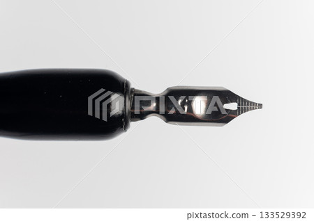 Black contemporary pen on white paper, minimal composition. Macro photo of the pen tip 133529392