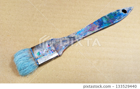 Close-up of art tools lined up with well-used paintbrushes 34 Close-up of art tools lined up with well-used paintbrushes 34 133529440