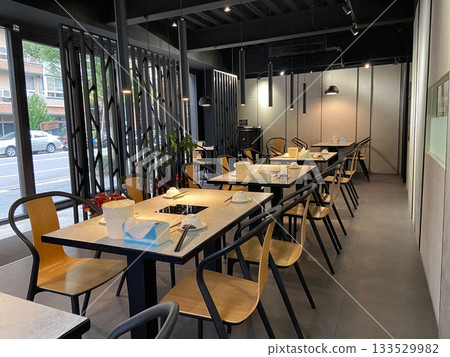 Interior of modern restaurant, attached chair 133529982