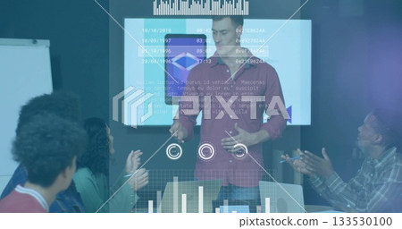 Presenting speaker in red button-up talking at meeting table, with display screen and whiteboard 133530100