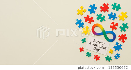 Autism Awareness Day colorful puzzle concept on light background Autism Awareness Day colorful puzzle concept on light background 133530652