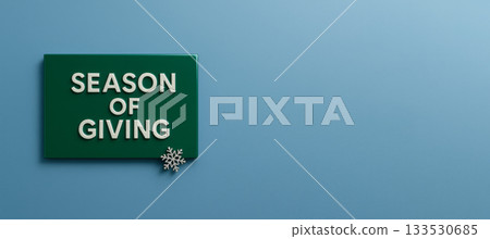 Season of giving green sign with snowflake on blue background 133530685