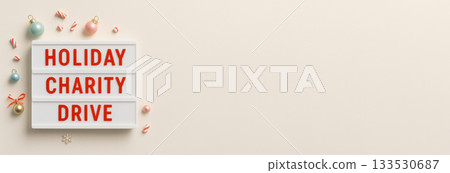 Holiday charity drive sign with festive decorations on a neutral background Holiday charity drive sign with festive decorations on a neutral background 133530687