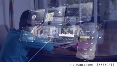 Interacting senior man using digital dashboards on laptop in home workspace, with child and pencils Interacting senior man using digital dashboards on laptop in home workspace, with child and pencils 133530811