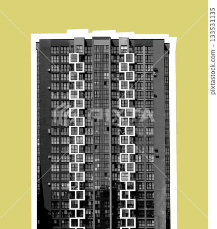 Black and white high-rise apartment building with a symmetrical facade of square balconies forming Black and white high-rise apartment building with a symmetrical facade of square balconies forming 133531135