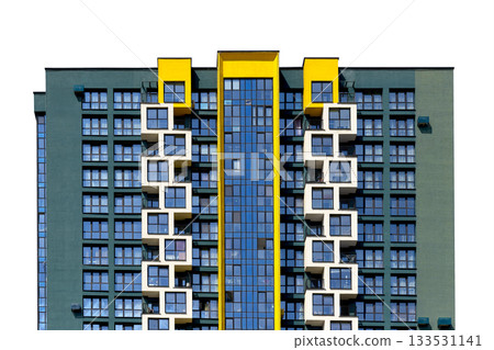 Contemporary apartment building with striking yellow accents and a glass central facade. Modern 133531141