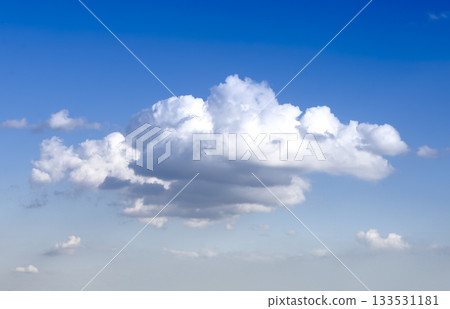 Cloud in blue sky with fluffy shape. White airy formation with soft bright light and natural horizon Cloud in blue sky with fluffy shape. White airy formation with soft bright light and natural horizon 133531181