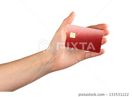 Red metallic credit card with chip, displayed in an open hand. Modern banking card isolated on white 133531222