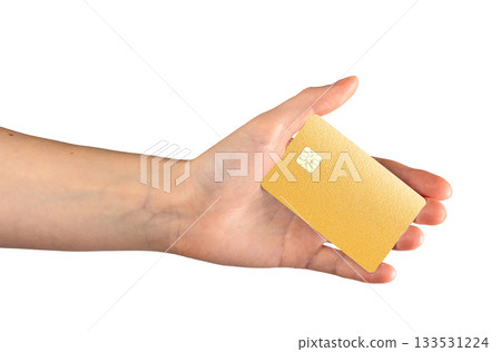 Golden textured bank card with chip held in hand. Premium credit or debit card isolated on white Golden textured bank card with chip held in hand. Premium credit or debit card isolated on white 133531224
