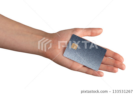 Dark blue metallic card resting on palm with glossy surface. Plastic chip used for secure protection Dark blue metallic card resting on palm with glossy surface. Plastic chip used for secure protection 133531267