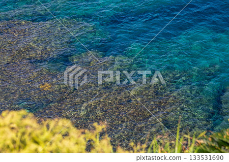 Okinomanzamo: Gradually stratified sea water and cliffs with azure blue color during sunny weather in summer 133531690