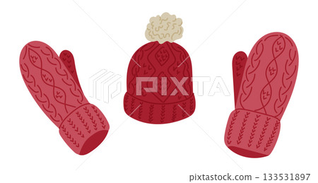 A warm knitted hat with matching mittens features cozy patterns in soft winter colors. The concept represents winter clothing, cold weather comfort and seasonal warmth 133531897