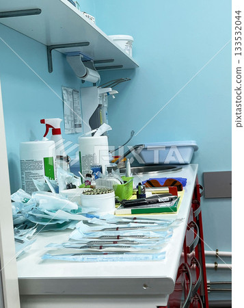 A countertop filled with medical tools and supplies in a clinic A countertop filled with medical tools and supplies in a clinic 133532044
