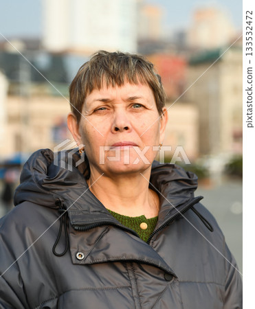 Portrait of a 60-year-old Russian woman with ptosis of the eyelid Portrait of a 60-year-old Russian woman with ptosis of the eyelid 133532472