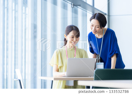 Businesswomen working in the office. Filming cooperation: Sky Perfect Tokyo Media Center Businesswomen working in the office. Filming cooperation: Sky Perfect Tokyo Media Center 133532786