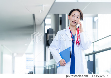 Female doctor working at the hospital. Filming cooperation: Sky Perfect Tokyo Media Center Female doctor working at the hospital. Filming cooperation: Sky Perfect Tokyo Media Center 133532803