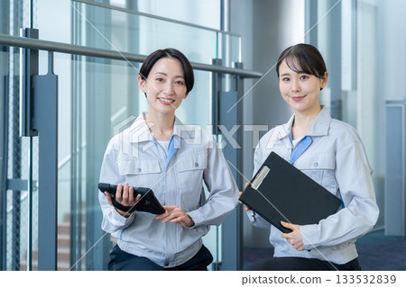 Female building maintenance engineer. Filming cooperation: Sky Perfect Tokyo Media Center. Female building maintenance engineer. Filming cooperation: Sky Perfect Tokyo Media Center. 133532839