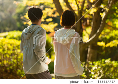 A middle-aged couple walking outdoors 133532852