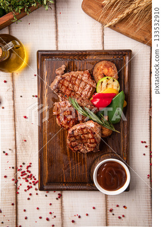 Grilled beef steak portion with vegetables Grilled beef steak portion with vegetables 133532910