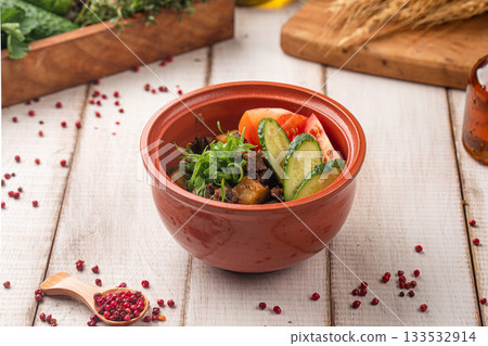 Rustic clay pot with stewed meat potatoes vegetables 133532914