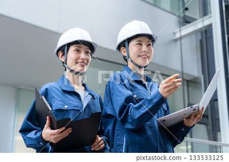 Female building maintenance engineer. Filming cooperation: Sky Perfect Tokyo Media Center. Female building maintenance engineer. Filming cooperation: Sky Perfect Tokyo Media Center. 133533125