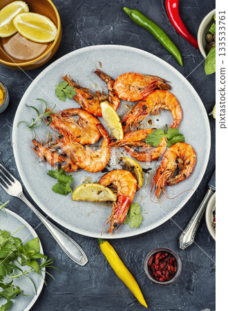 Langoustines fried in butter with garlic. Langoustines fried in butter with garlic. 133533761
