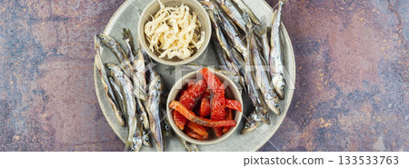 Beer and dried fish. 133533763