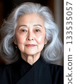 Elegant senior woman with gray hair posing in studio portrait 133535057
