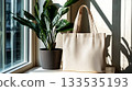 Beige tote bag mockup with green plant near window 133535193