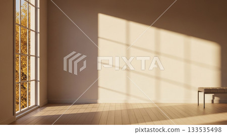 Bright Empty Minimalist Room Interior with Warm Sunlight and Geometric Window Shadow Pattern on Neutral Wall 133535498