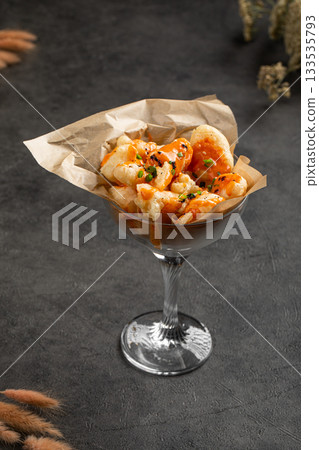 Crispy shrimp bites served with creamy sauce Crispy shrimp bites served with creamy sauce 133535793