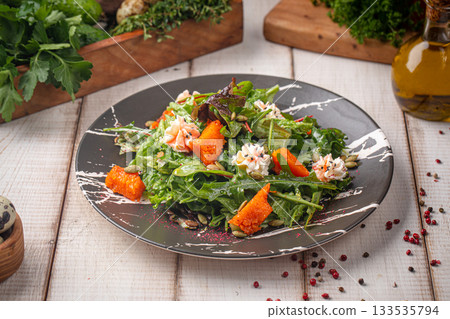Fresh pumpkin salad with greens mix Fresh pumpkin salad with greens mix 133535794